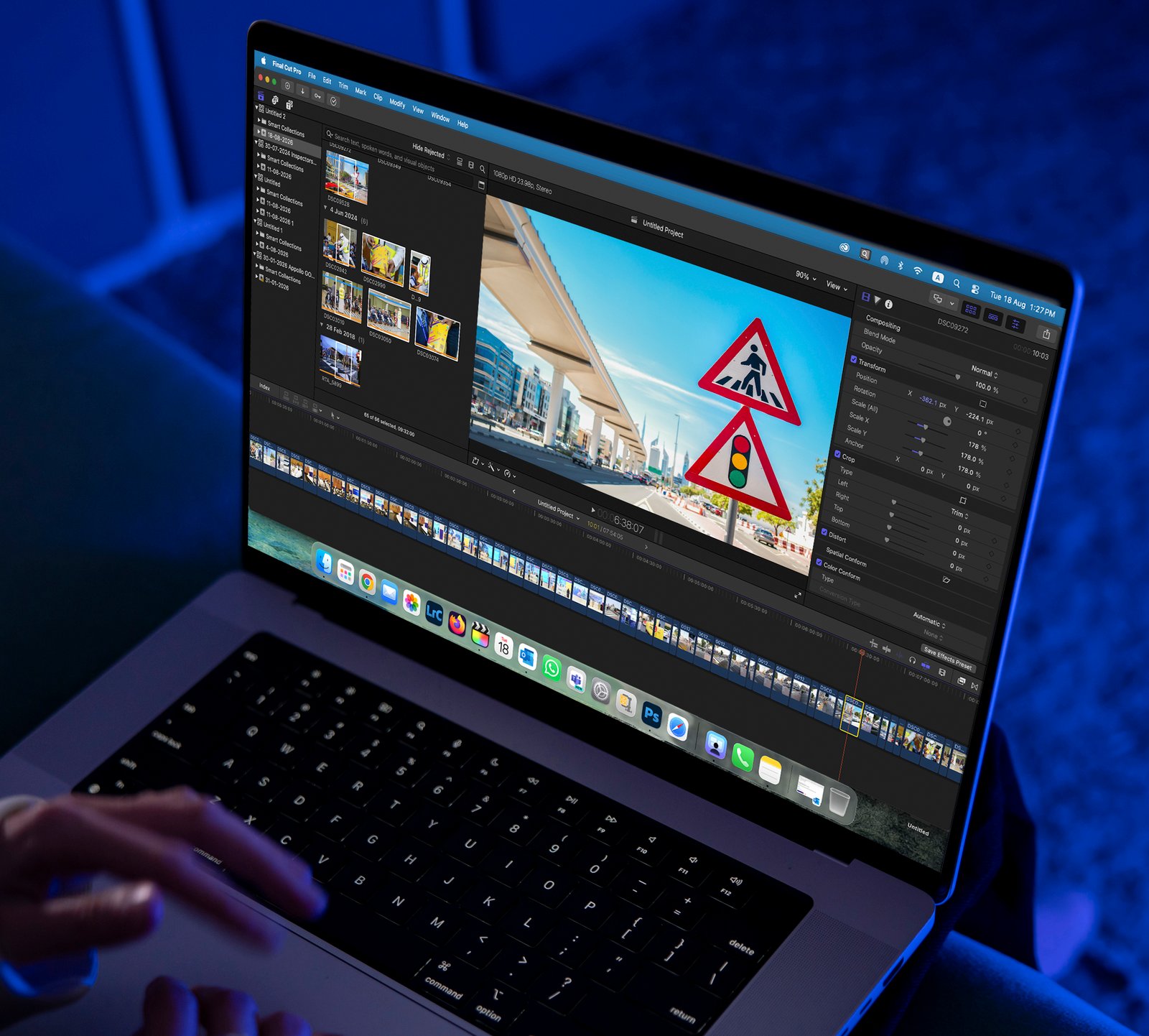 Video Editor Working on Laptop With Editing Software in a Dimly Lit Room in the night